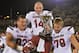 COLUMBIA, MO - OCTOBER 26: Quarterback Connor Shaw #14 of the South Carolina Gamecocks carriers the Mayor's Cup off the field with teammates Mason Zandi #83 and Cody Gibson #78 after beating the Missouri Tigers on October 26, 2013 at Faurot Field/Memorial Stadium in Columbia, Missouri. South Carolina defeated Missouri in double overtime 27-24. (Photo by Peter Aiken/Getty Images)