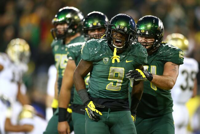 Hi-res-185978658-byron-marshall-of-the-oregon-ducks-celebrates-a_crop_north