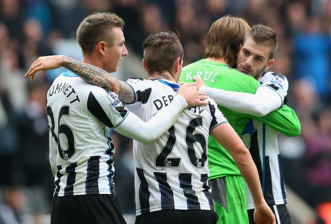 Hi-res-185346752-paul-dummett-of-newcastle-united-hugs-mathieu-debuchy_crop_north