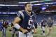 Aug 29, 2013; Foxborough, MA, USA; New England Patriots quarterback Tim Tebow (5) exits the field after the game against the New York Giants at Gillette Stadium. The Patriots defeated the Giants 28-20. Mandatory Credit: David Butler II-USA TODAY Sports