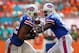 MIAMI GARDENS, FL - OCTOBER 20: Thad Lewis #9 of the Buffalo Bills hands off to Fred Jackson #22 during a game against the Miami Dolphins at Sun Life Stadium on October 20, 2013 in Miami Gardens, Florida. (Photo by Mike Ehrmann/Getty Images)