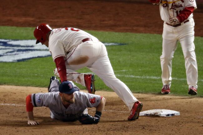 Hi-res-185982589-allen-craig-of-the-st-louis-cardinals-gets-tripped-up_crop_north