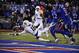 Oct 26, 2013; Lawrence, KS, USA; Baylor Bears wide receiver Tevin Reese (16) dives in for a touchdown against Kansas Jayhawks linebacker Cassius Sendish (33) and cornerback Dexter McDonald (12) in the first half at Memorial Stadium. Mandatory Credit: John Rieger-USA TODAY Sports
