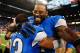 Oct 27, 2013; Detroit, MI, USA; Detroit Lions wide receiver Calvin Johnson (81) celebrates with cornerback Chris Houston (23) after defeating the Dallas Cowboys 31-30 at Ford Field. Mandatory Credit: Andrew Weber-USA TODAY Sports