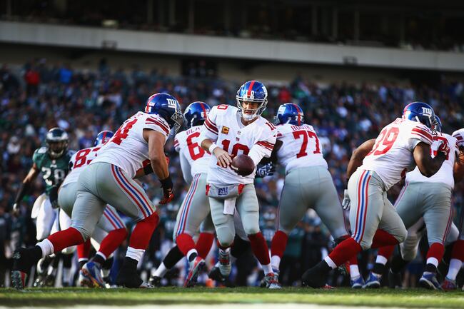 Hi-res-186042961-eli-manning-of-the-new-york-giants-hands-the-ball-off_crop_north