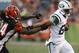 Oct 27, 2013; Cincinnati, OH, USA; Cincinnati Bengals cornerback Adam Jones (24) tackles New York Jets wide receiver David Nelson (86) during the game at Paul Brown Stadium. Cincinnati defeated New York 49-9. Mandatory Credit: Mark Zerof-USA TODAY Sports