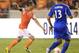 Oct 4, 2013; Houston, TX, USA; Houston Dynamo midfielder Brad Davis (11) shoots against Montreal Impact defender Matteo Ferrari (13) during the second half at BBVA Compass Stadium. The Dynamo won 1-0. Mandatory Credit: Thomas Campbell-USA TODAY Sports