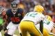 CHICAGO, IL - DECEMBER 16: Lance Briggs #55 of the Chicago Bears keeps his eyes on Aaron Rodgers #12 the Green Bay Packers at Soldier Field on December 16, 2012 in Chicago, Illinois. The Packers defeated the Bears 21-13. (Photo by Jonathan Daniel/Getty Images)