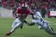Oct 26, 2013; Columbus, OH, USA; Ohio State Buckeyes running back Ezekiel Elliott (15) breaks a tackle attempted by Penn State Nittany Lions cornerback Jordan Lucas (9) at Ohio Stadium. Mandatory Credit: Greg Bartram-USA TODAY Sports