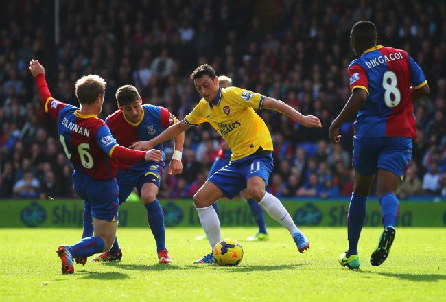 Hi-res-185917786-mesut-oezil-of-arsenal-is-challenged-by-barry-bannan_crop_north