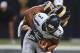 ST. LOUIS, MO - OCTOBER 28: Russell Wilson #3 of the Seattle Seahawks is sacked during the first quarter by Robert Quinn #94 of the St. Louis Rams at the Edward Jones Dome on October 28, 2013 in St. Louis, Missouri. (Photo by Michael Thomas/Getty Images)