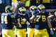 November 17, 2012; Ann Arbor, MI, USA;Michigan Wolverines tight end A.J. Williams (84) - quarterback Devin Gardner (12) and offensive linesman Michael Schofield (75) during the game against the Iowa Hawkeyes at Michigan Stadium. Mandatory Credit: Rick Osentoski-USA TODAY Sports