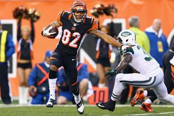 Hi-res-186054608-marvin-jones-of-the-cincinnati-bengals-runs-for-a_crop_north
