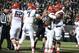 Oct 26, 2013; Boulder, CO, USA; Arizona Wildcats running back Ka'Deem Carey (center) is congratulated for his touchdown by offensive linesman Steven Gurrola (56) and quarterback B.J. Denker (7) and offensive linesman Chris Putton (62) in the third quarter against the Colorado Buffaloes at Folsom Field. The Wildcats defeated the Buffaloes 44-20. Mandatory Credit: Ron Chenoy-USA TODAY Sports