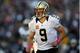 FOXBORO, MA - OCTOBER 13: Quarterback Drew Brees #9 of the New Orleans Saints jogs off the field after failing to convert a first down against the New England Patriots during the first half at Gillette Stadium on October 13, 2013 in Foxboro, Massachusetts. (Photo by Rob Carr/Getty Images)