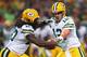 ST. LOUIS, MO - AUGUST 17: Aaron Rodgers #12 of the Green Bay Packershands the ball off to Eddie Lacy #27 of the Green Bay Packers during a preseason game against the St. Louis Rams at the Edward Jones Dome on August 17, 2013 in St. Louis, Missouri. (Photo by Dilip Vishwanat/Getty Images)