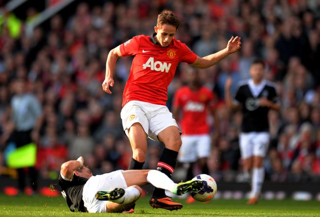 Hi-res-185347234-adnan-januzaj-of-manchester-united-is-tackled-by-morgan_crop_north