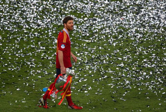 Hi-res-147540230-xabi-alonso-of-spain-with-the-trophy-after-the-uefa_crop_north