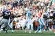 Oct 27, 2013; Foxborough, MA, USA; Miami Dolphins quarterback Ryan Tannehill (17) throws a pass against the New England Patriots during the fourth quarter at Gillette Stadium. The Patriots defeated the Dolpins 27-17. Mandatory Credit: Stew Milne-USA TODAY Sports