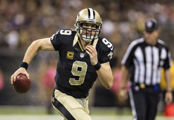 Hi-res-186046743-drew-brees-of-the-new-orleans-saints-runs-the-ball_crop_north