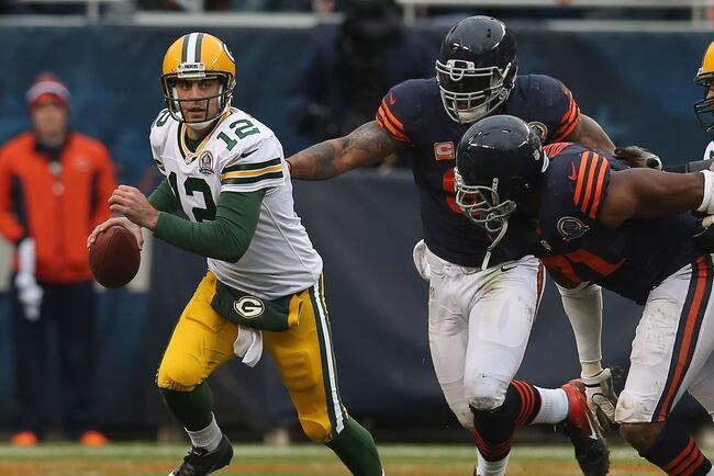 Hi-res-158495442-aaron-rodgers-of-the-green-bay-packers-is-chased-by_crop_north