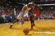 MIAMI, FL - OCTOBER 29: LeBron James #6 of the Miami Heat drives around Luol Deng #9 of the Chicago Bulls during a game at American Airlines Arena on October 29, 2013 in Miami, Florida. (Photo by Mike Ehrmann/Getty Images)