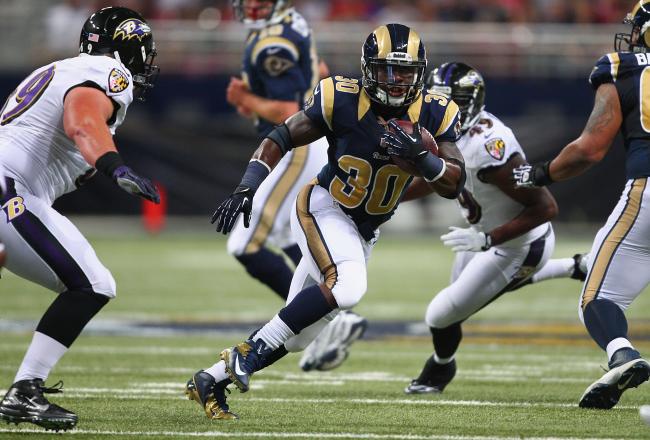 Hi-res-178358136-zac-stacy-of-the-st-louis-rams-rushes-against-the_crop_north