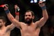 Mar 16, 2013; Montreal, Quebec, CAN; Johny Hendricks (blue) celebrates after his main card bout against Carlos Condit (red) at UFC 158 at the Bell Centre. Mandatory Credit: Eric Bolte-USA TODAY Sports