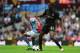 BIRMINGHAM, ENGLAND - SEPTEMBER 28: Manchester City player Yaya Toure (r) holds off Villa player Leandro Bacuna during the Barclays Premier League match between Aston Villa and Manchester City at Villa Park on September 28, 2013 in Birmingham, England. (Photo by Stu Forster/Getty Images)