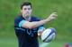 BAGSHOT, ENGLAND - OCTOBER 28: Joel Tomkins passes the ball during the England training session held at Pennyhill Park on October 28, 2013 in Bagshot, England. (Photo by David Rogers/Getty Images)