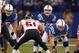 Dec 30 2012; Indianapolis, IN, USA; Indianapolis Colts quarterback Andrew Luck (12) takes a snap under center against the Houston Texans at Lucas Oil Stadium. Mandatory Credit: Brian Spurlock-USA TODAY Sports