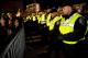 BOSTON, MA - OCTOBER 30: Boston Police line up along a barrier securing the area around Fenway Park after the Boston Red Sox defeated the St. Louis Cardinals 6-1 in Game Six of the 2013 World Series on October 30, 2013 in Boston, Massachusetts. (Photo by Kayana Szymczak/Getty Images)