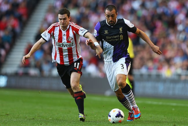 Hi-res-182291513-jose-enrique-of-liverpool-is-challenged-by-adam-johnson_crop_north
