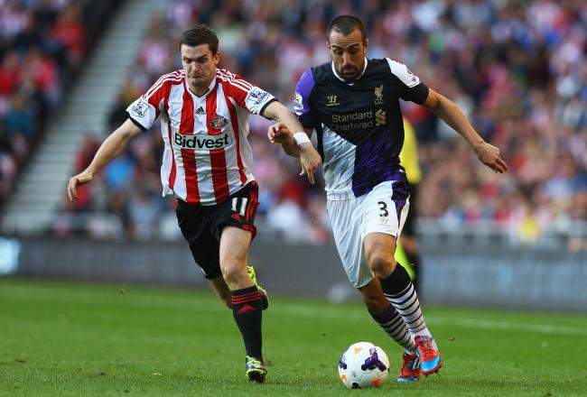 Hi-res-182291513-jose-enrique-of-liverpool-is-challenged-by-adam-johnson_crop_north