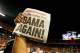 MIAMI GARDENS, FL - JANUARY 07: A member of the Alabama Crimson Tide holds up a newpaper front page with a headline reading 'Bama Again!' after they defeated the Notre Dame Fighting Irish by a score of 42-14 to win the 2013 Discover BCS National Championship game at Sun Life Stadium on January 7, 2013 in Miami Gardens, Florida. (Photo by Kevin C. Cox/Getty Images)
