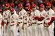The Cardinals stand on the field before Game 3 of the World Series.