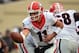 Oct 19, 2013; Nashville, TN, USA; Georgia Bulldogs quarterback Aaron Murray (11) drops back to hand off against the Vanderbilt Commodores during the first half at Vanderbilt Stadium. The Commodores beat the Bulldogs 31-27. Mandatory Credit: Don McPeak-USA TODAY Sports