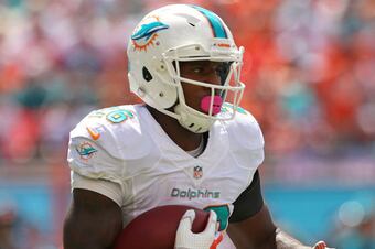 Hi-res-183447432-lamar-miller-of-the-miami-dolphins-rushes-during-a-game_crop_650_crop_north
