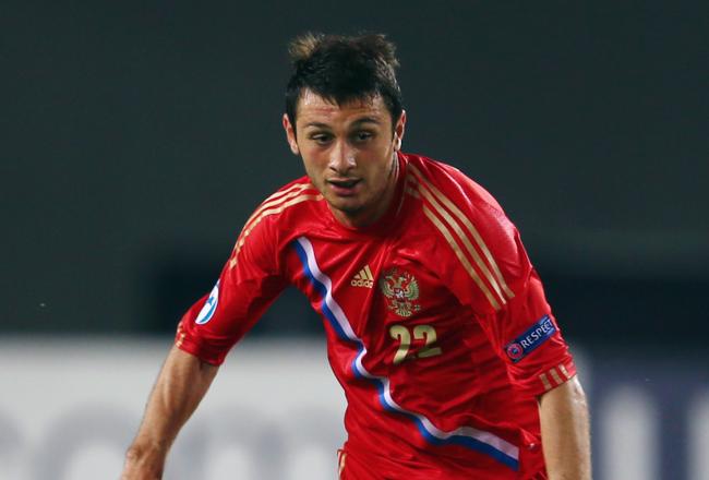 Hi-res-170446744-alan-dzagoev-of-russia-controles-the-ball-during-the_crop_north