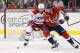 Oct 10, 2013; Washington, DC, USA; Washington Capitals right wing Eric Fehr (16) battles for the puck with Carolina Hurricanes defenseman Justin Faulk (27) in the third period at Verizon Center. The Hurricanes won 3-2. Mandatory Credit: Geoff Burke-USA TODAY Sports