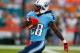 Nov 11, 2012; Miami Gardens, FL, USA; Tennessee Titans running back Chris Johnson (28) runs past Miami Dolphins defenders for a touchdown in the first quarter at Sun Life Stadium. Mandatory Credit: Robert Mayer-USA TODAY Sports