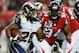 ATLANTA, GA - SEPTEMBER 15: Daryl Richardson #26 of the St. Louis Rams rushes away from Peria Jerry #94 of the Atlanta Falcons at Georgia Dome on September 15, 2013 in Atlanta, Georgia. (Photo by Kevin C. Cox/Getty Images)