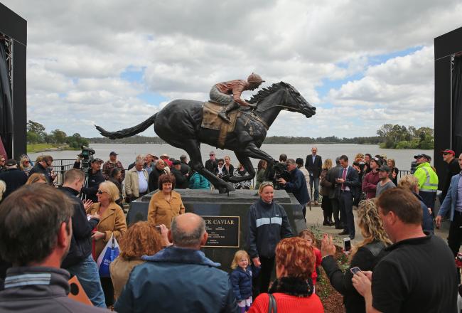 Hi-res-185698740-people-look-at-the-statue-after-the-unveiling-of-the_crop_north