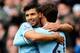 MANCHESTER, ENGLAND - NOVEMBER 02: David Silva of Manchester City celebrates scoring the second goal with his team-mate Sergio Aguero (L) during the Barclays Premier League match between Manchester City and Norwich City at Etihad Stadium on November 2, 2013 in Manchester, England. (Photo by Ben Hoskins/Getty Images)