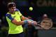 PARIS, FRANCE - NOVEMBER 02: David Ferrer of Spain plays a backhand in his match against Rafael Nadal of Spain during day six of the BNP Paribas Masters at Palais Omnisports de Bercy on November 2, 2013 in Paris, France. (Photo by Julian Finney/Getty Images)