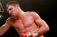 HULL, ENGLAND - JULY 13: Derry Matthews (L) in action with Tommy Coyle during their Vacant Commonwealth Lightweight Championship bout at Craven Park Stadium on July 13, 2013 in Hull, England. (Photo by Scott Heavey/Getty Images)