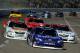 FORT WORTH, TX - NOVEMBER 02: Elliott Sadler, driver of the #11 OneMain Financial Toyota, leads Parker Kligerman, driver of the #77 ToyotaDreamBuild.com Toyota, and Cole Whitt, driver of the #44 Takagi Tankless Water Heaters Toyota, during the NASCAR Nationwide Series O'Reilly Auto Parts 300 at Texas Motor Speedway on November 2, 2013 in Fort Worth, Texas. (Photo by Jared C. Tilton/Getty Images for Texas Motor Speedway)