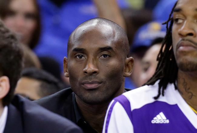 Hi-res-186399050-kobe-bryant-of-the-los-angeles-lakers-sits-on-the-bench_crop_north