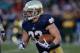 SOUTH BEND, IN - NOVEMBER 02: Cam McDaniel #33 of the Notre Dame Fighting Irish runs for a touchdown against the Navy Midshipmen at Notre Dame Stadium on November 2, 2013 in South Bend, Indiana. Notre Dame defeated Navy 38-34. (Photo by Jonathan Daniel/Getty Images)