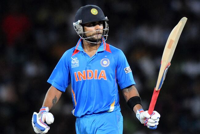 Hi-res-153114454-virat-kholi-of-india-raises-his-bat-after-scoring-a_crop_north